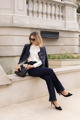 a lady in a white shirt, a sequin tweed jacket, a pair of skinny jeans and a pair of sunglasses